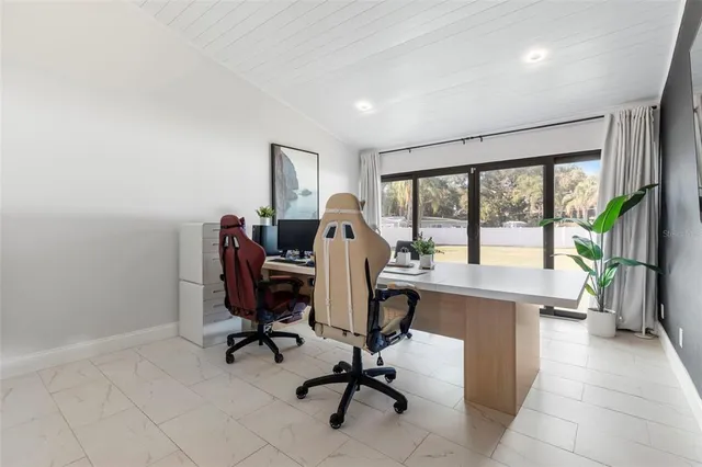 a bed room with a bed and a mirror