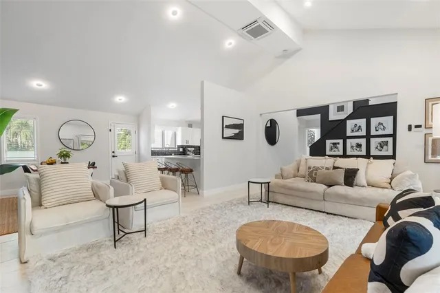 a kitchen with appliances a sink and cabinets