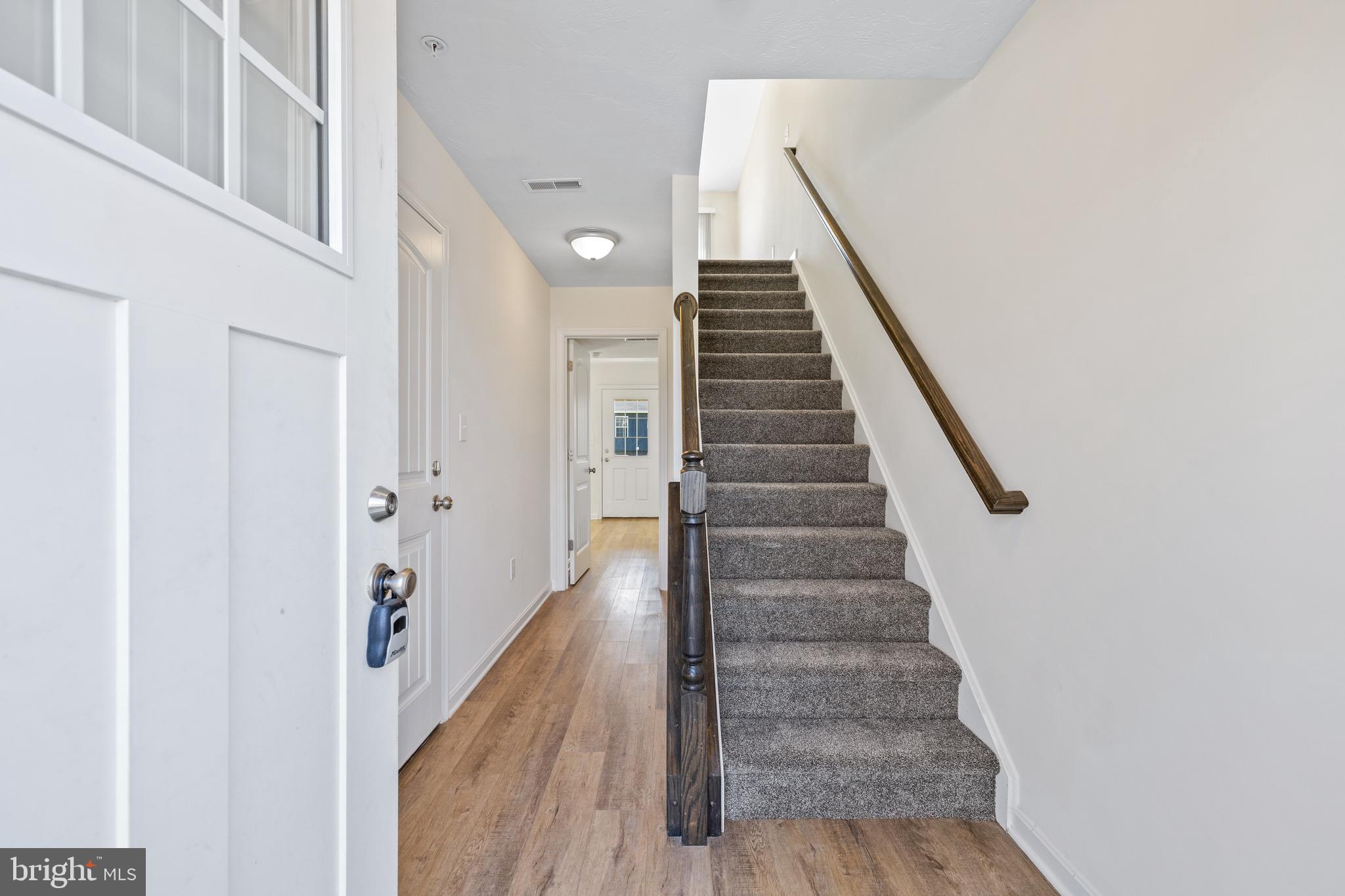 12 Secretariat Drive Hanover, PA 17331 - Photo 2 of 20 a view of a hallway with wooden floor and entryway