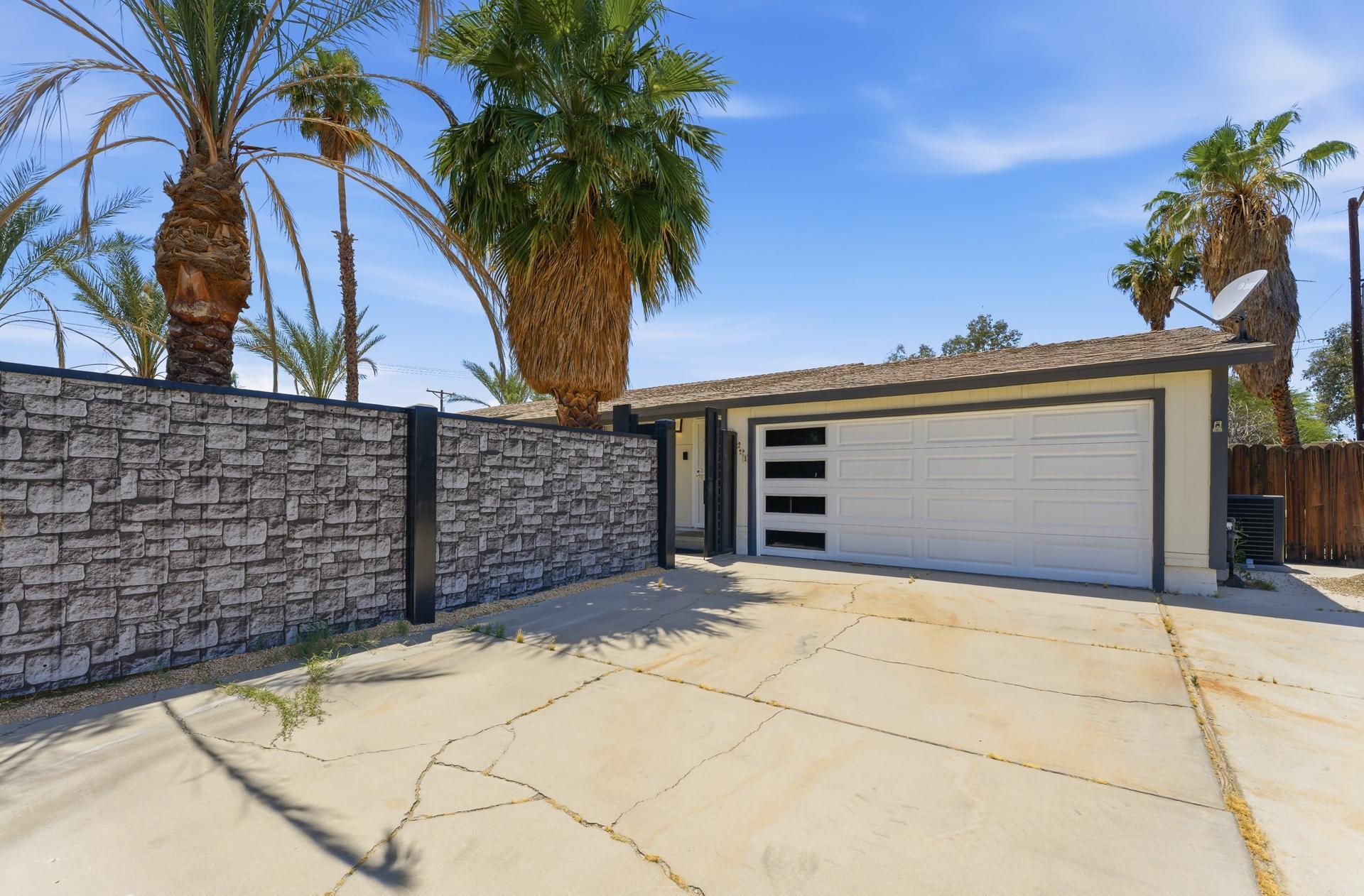40961 Cecina Way Bermuda Dunes, CA 92203 - Photo 3 of 27 a view of a house with a garage
