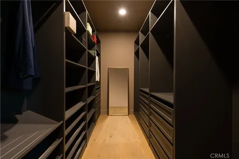 a bathroom with a granite countertop sink mirror vanity and toilet