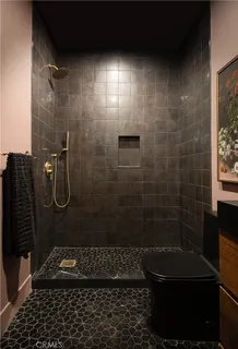 a bathroom with a double vanity sink mirror and toilet