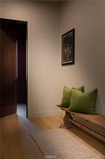 a wooden bench sitting in front of a building