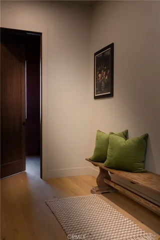 a wooden bench sitting in front of a building