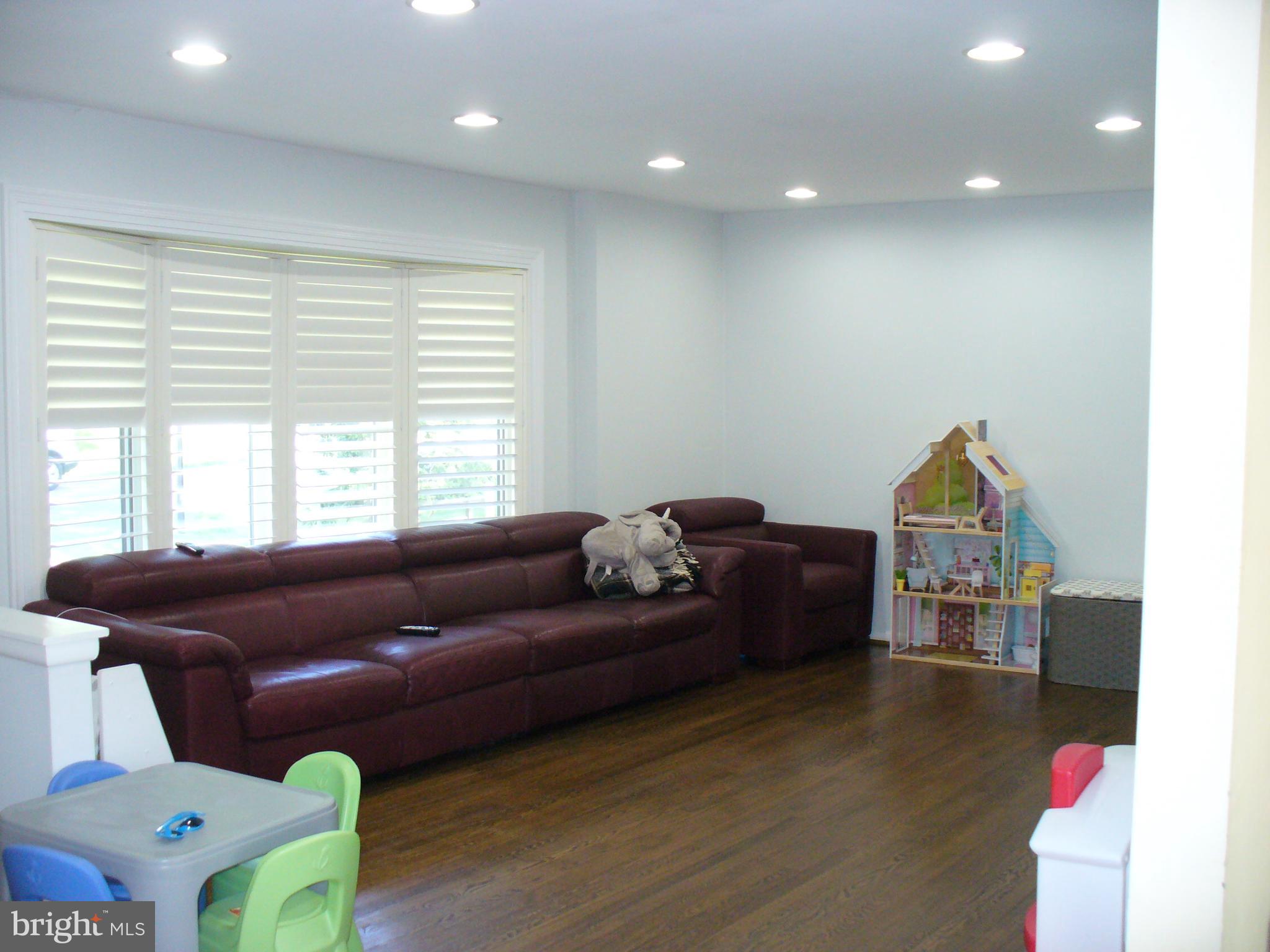 3424 Falling Green Road Olney, MD 20832 - Photo 16 of 47 Large living room with beautiful dark wood floors