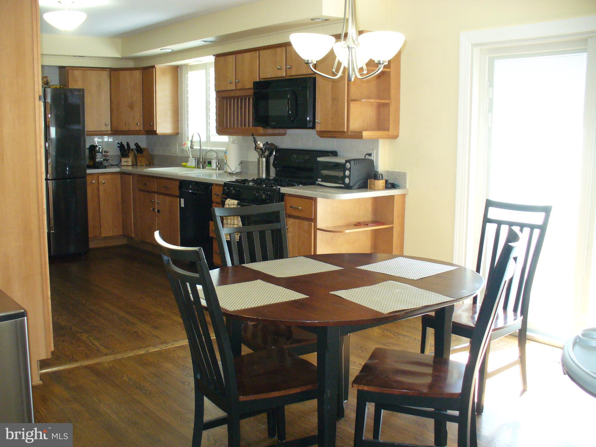 3424 Falling Green Road Olney, MD 20832 - Photo 20 of 47 Kitchen open to dining room, wood floors