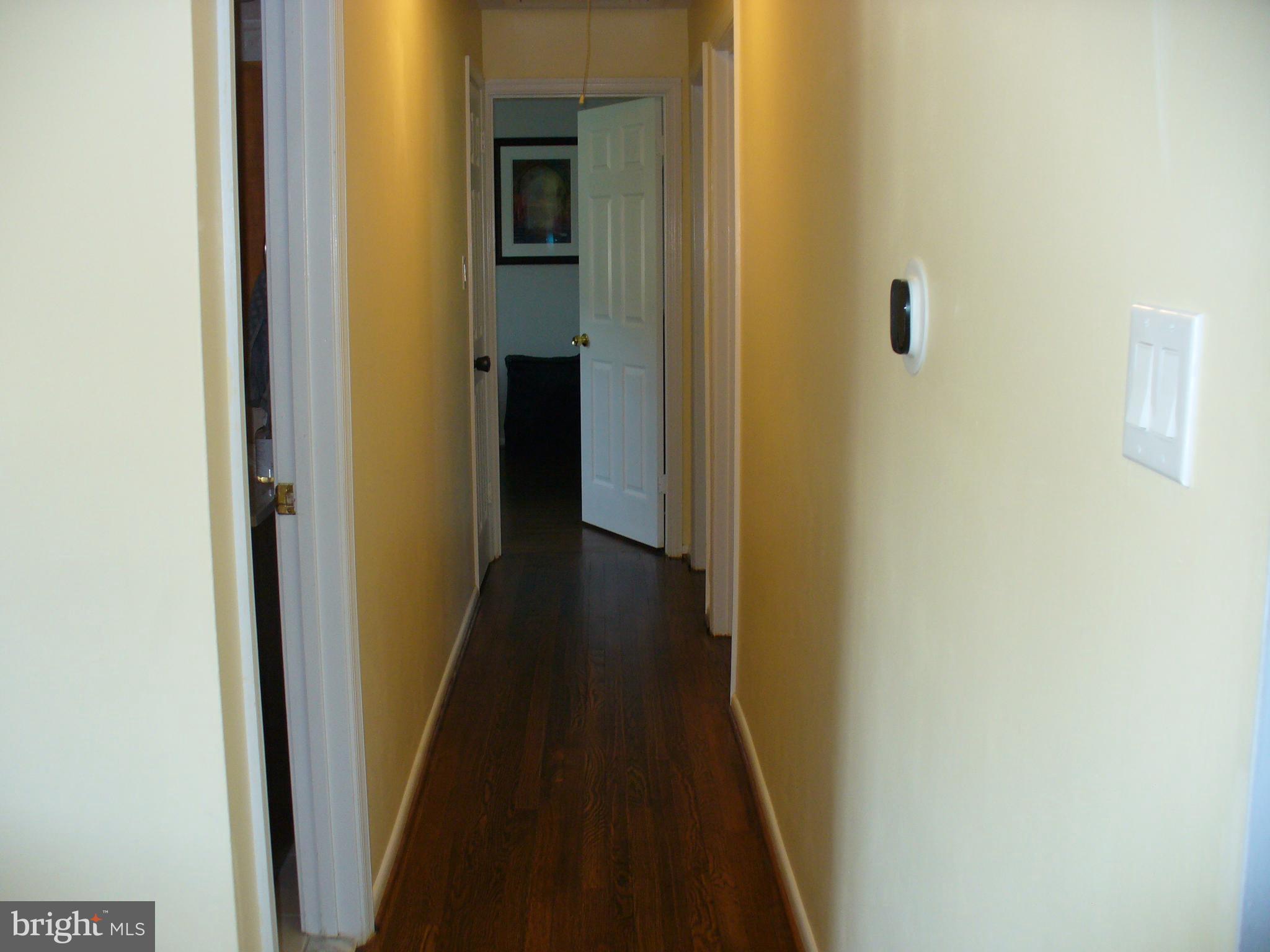 3424 Falling Green Road Olney, MD 20832 - Photo 25 of 47 Hallway with dark wood floors
