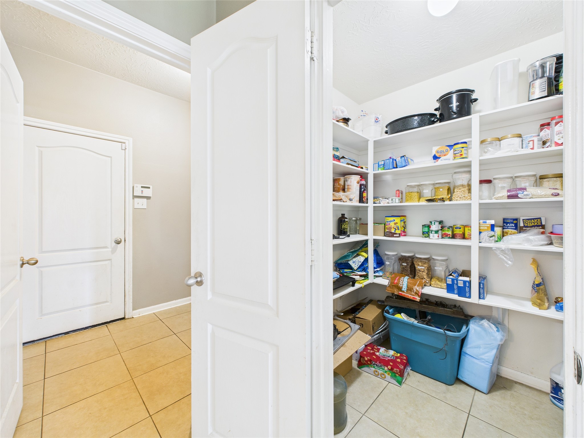 1484 Allison Street Alvin, TX 77511 - Photo 17 of 37 Large walk-in pantry just off the breakfast room and utility room. Makes unloading groceries a breeze!
