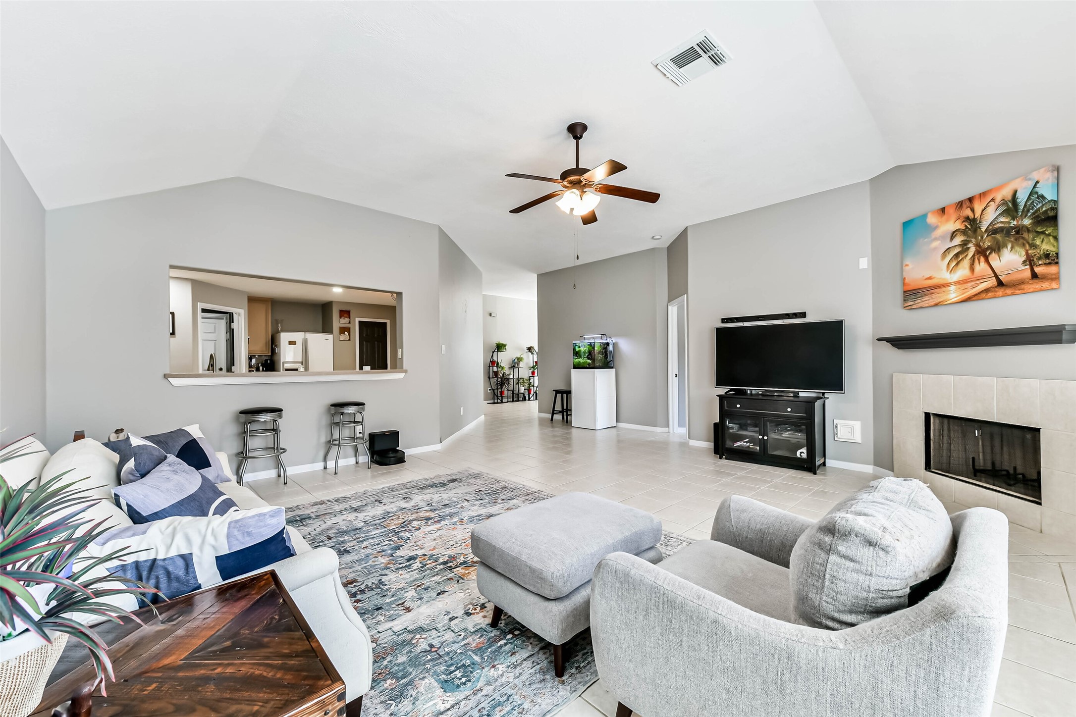 5114 Spring Oak Drive Pasadena, TX 77505 - Photo 13 of 25 a living room with furniture a flat screen tv and a fireplace