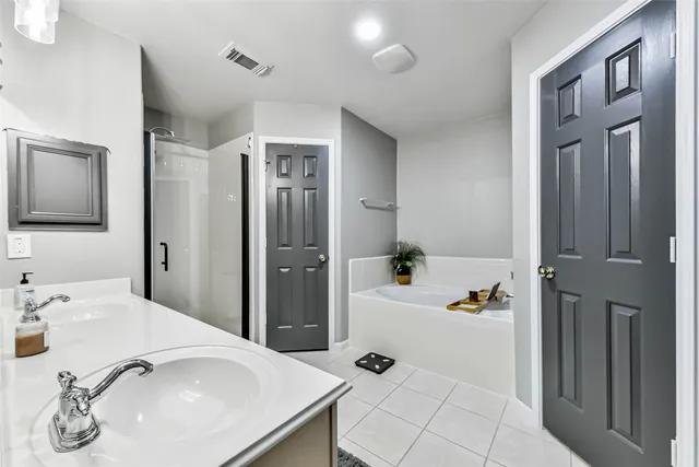 a view of kitchen with stainless steel appliances granite countertop a stove and a refrigerator