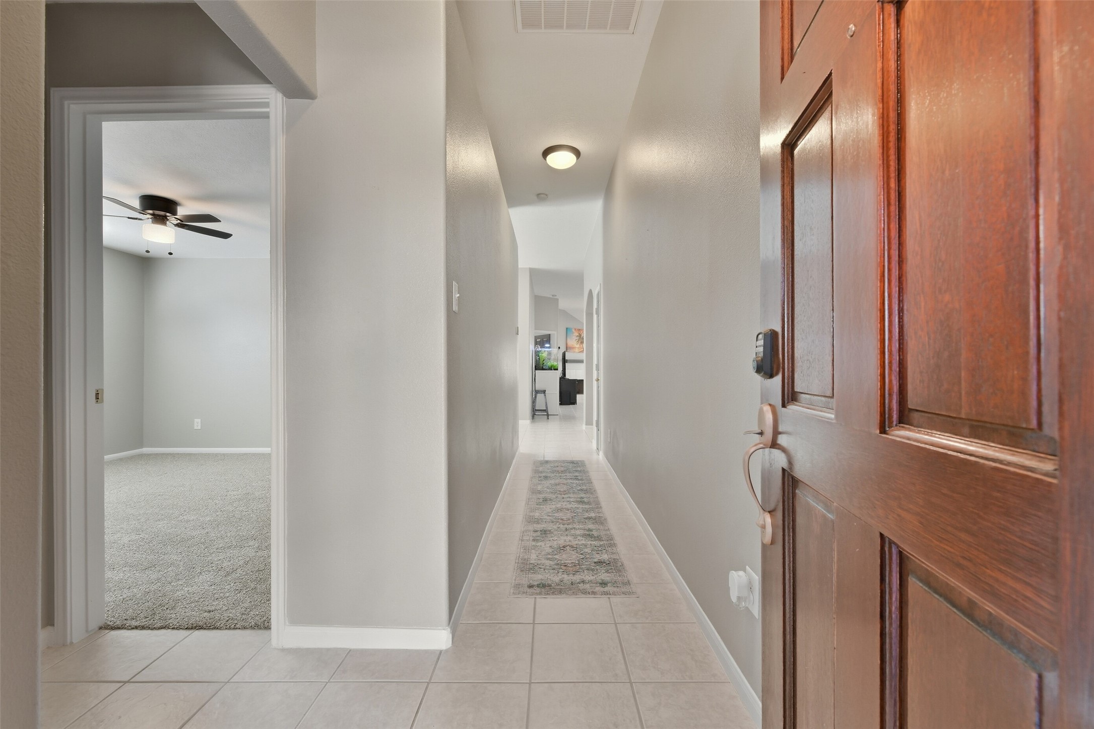 5114 Spring Oak Drive Pasadena, TX 77505 - Photo 4 of 25 a view of a hallway with wooden shelves
