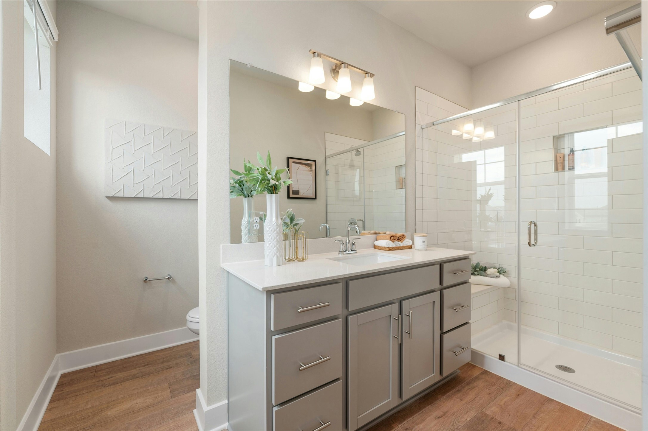 5804 Rotunda View Austin, TX 78747 - Photo 14 of 27 A sleek vanity with ample storage complements a pristine walk-in shower in this well-appointed bathroom.