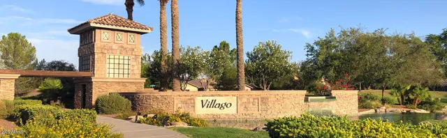 a front view of a house with a yard and a garage