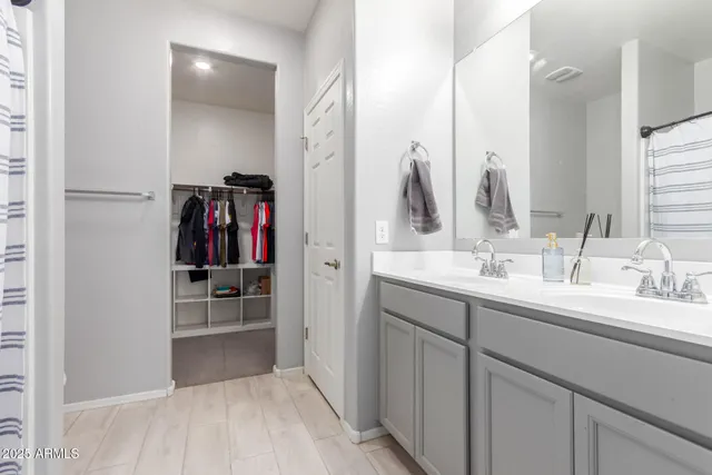 a view of a bedroom with toys and dresser