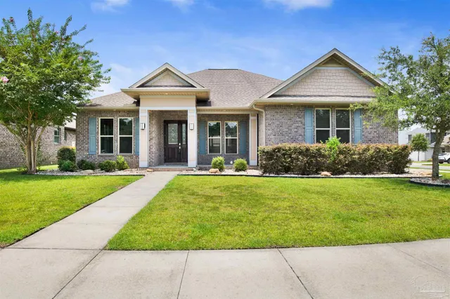 a view of a house with garden and yard
