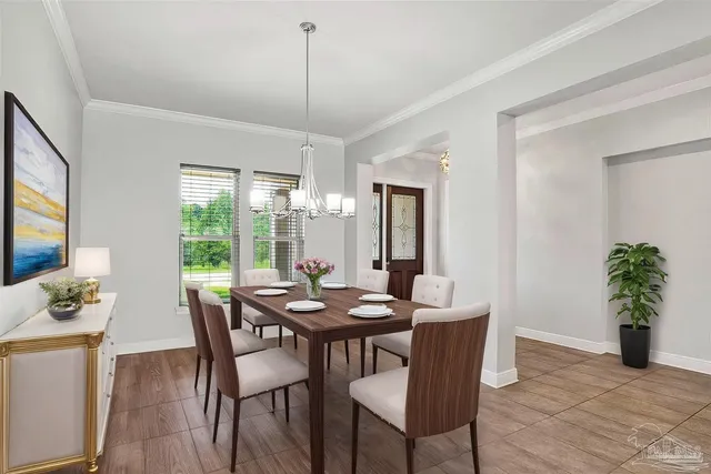 a view of a livingroom with a flat screen tv wooden floor and a ceiling fan