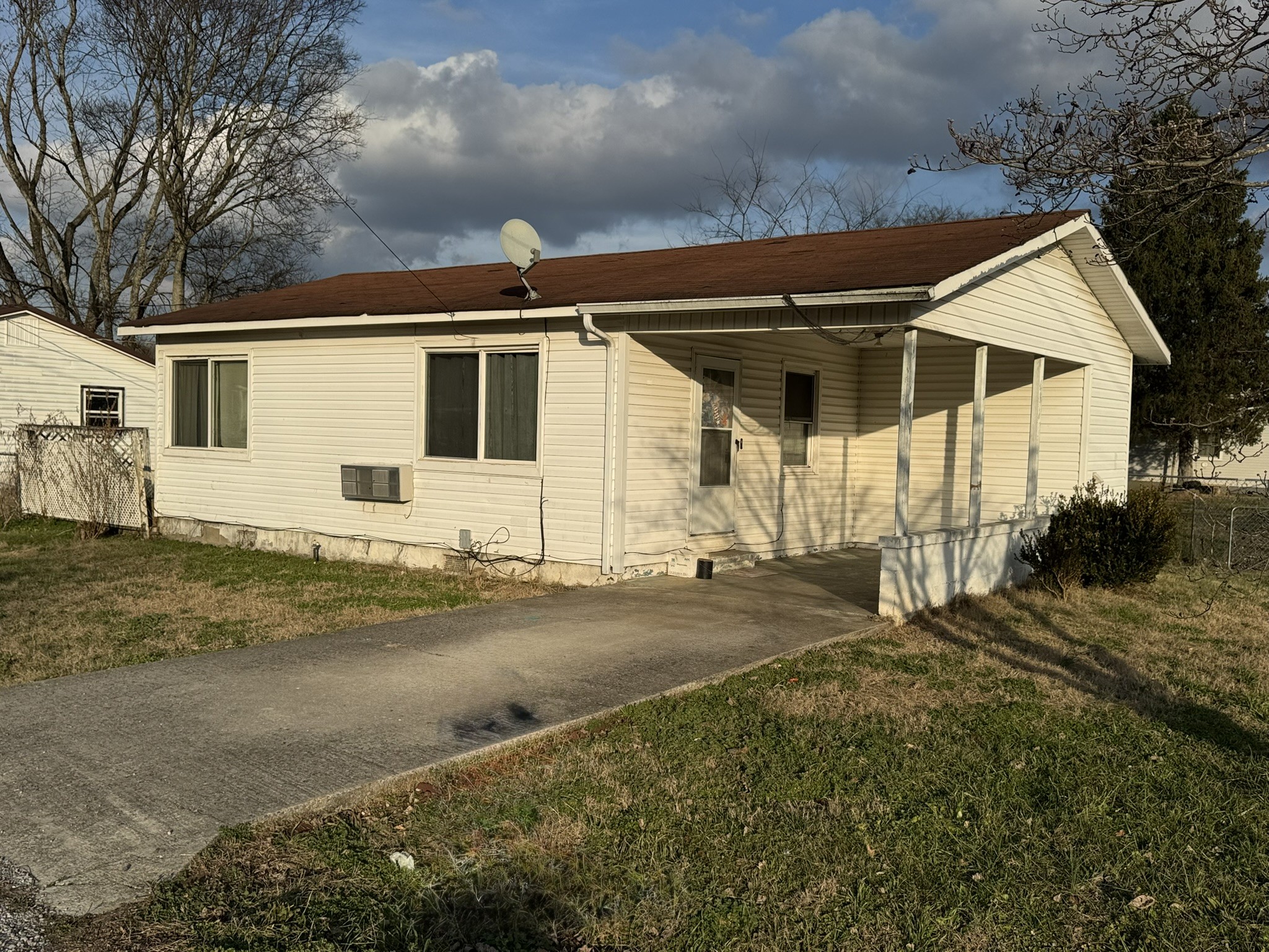 212 College Street North Cowan, TN 37318 - Photo 2 of 11 a view of a house with a yard