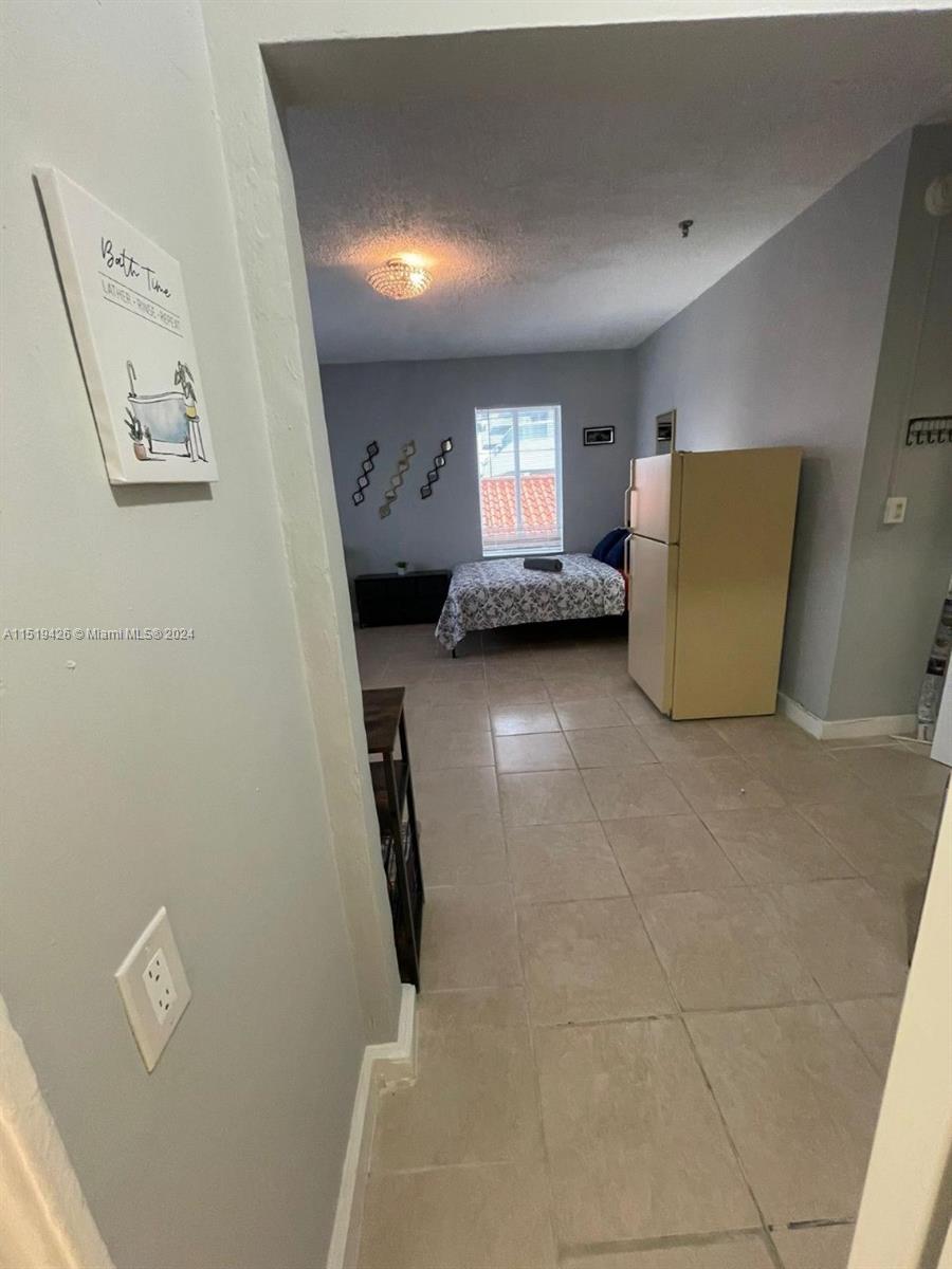 Mid Beach Miami Beach, FL 33140 - Photo 11 of 25 a view of room with window and furniture