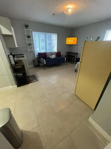 a bedroom with furniture and window