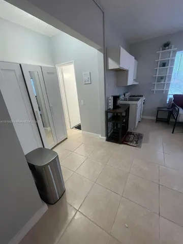 a kitchen with stainless steel appliances a stove a refrigerator and cabinets