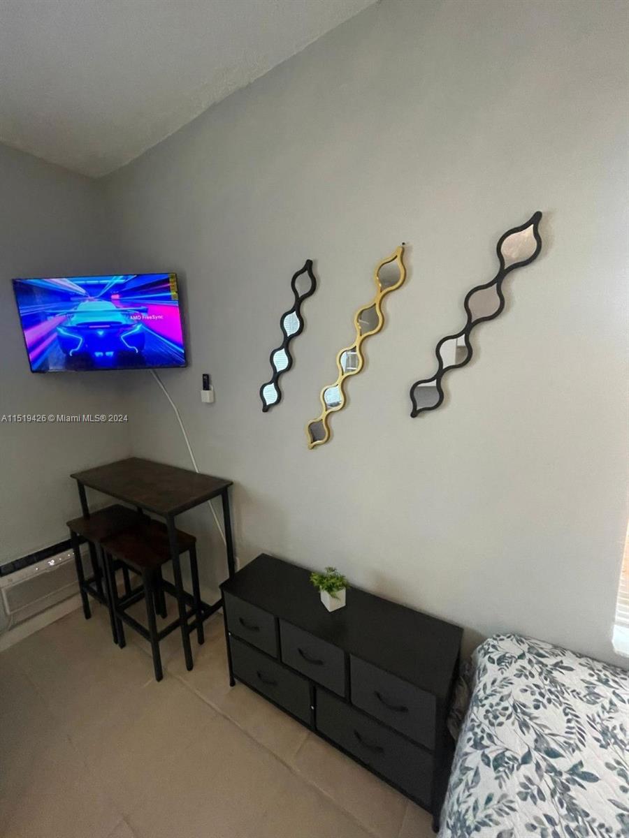 Mid Beach Miami Beach, FL 33140 - Photo 6 of 25 a living room with furniture and rug