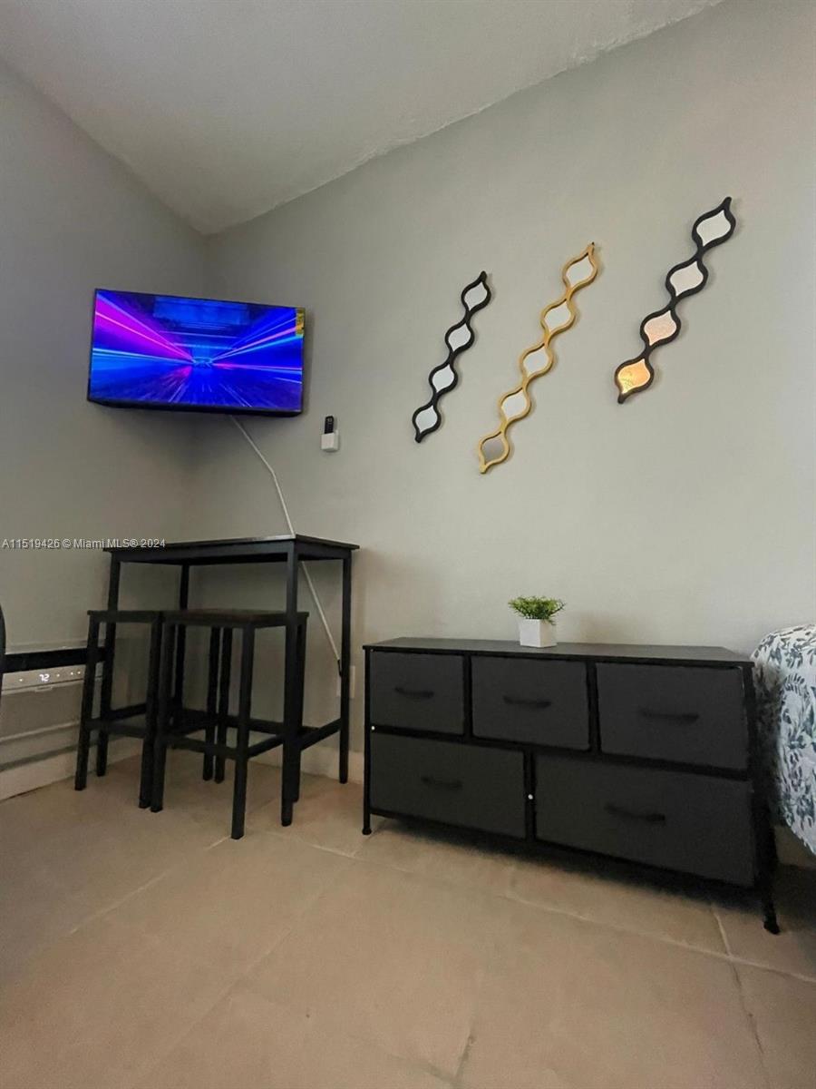 Mid Beach Miami Beach, FL 33140 - Photo 7 of 25 a view of a room with furniture and wooden floor