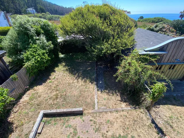 a backyard of a house with lots of green space