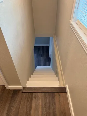 a view of a hallway with windows