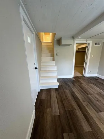 a view of a hallway view with staircase