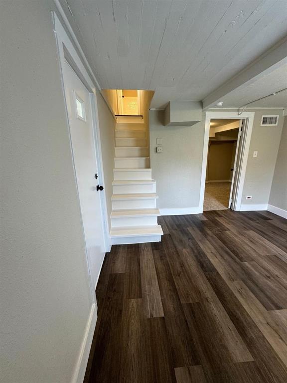 1201 North Rusk Street Weatherford, TX 76086 - Photo 16 of 32 a view of a room with wooden floor and stairs
