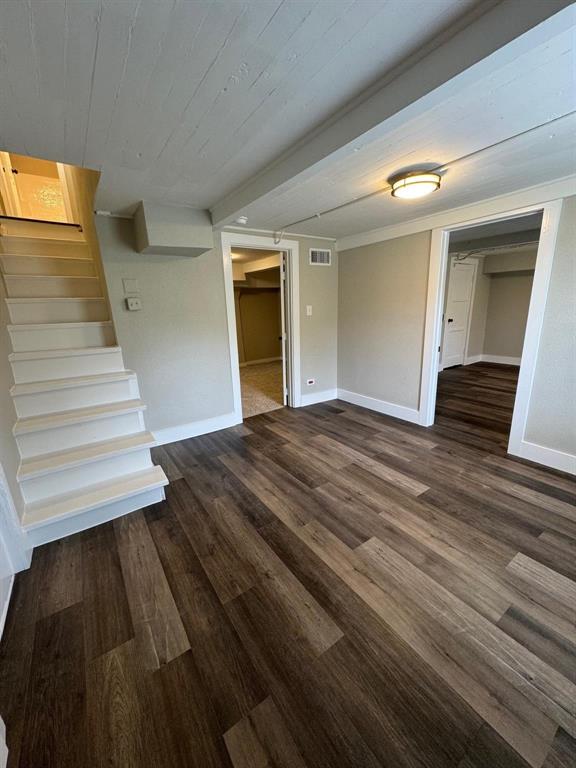 1201 North Rusk Street Weatherford, TX 76086 - Photo 18 of 32 a view of a room with wooden floor and stairs