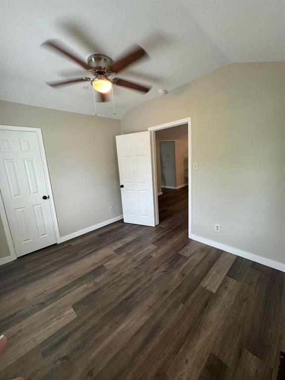 1201 North Rusk Street Weatherford, TX 76086 - Photo 26 of 32 a view of an empty room with wooden floor