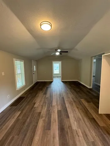 a view of kitchen and wooden floor