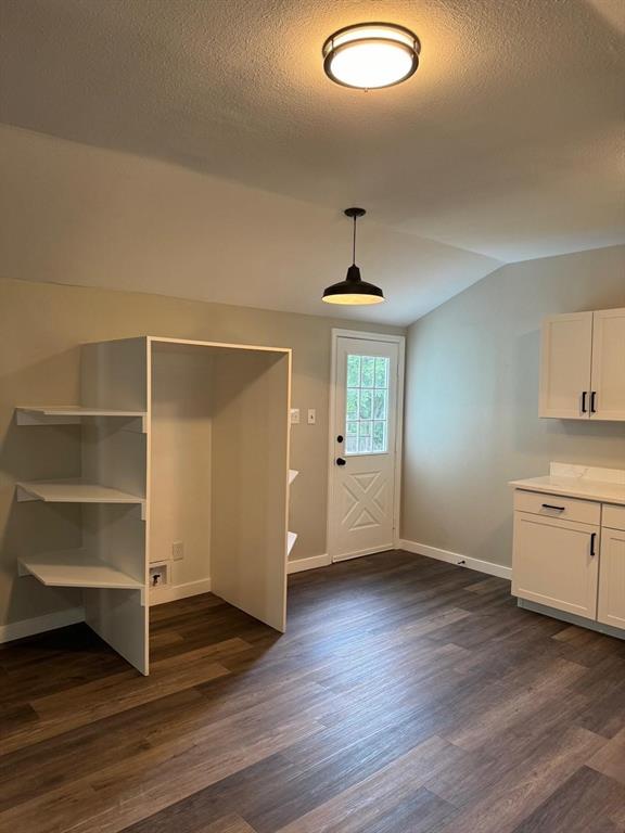 1201 North Rusk Street Weatherford, TX 76086 - Photo 30 of 32 a view of an empty room and window wooden floor