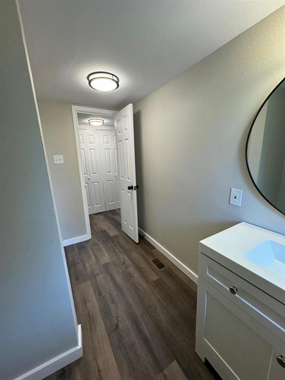 1201 North Rusk Street Weatherford, TX 76086 - Photo 5 of 32 a view of a room with wooden floor and staircase