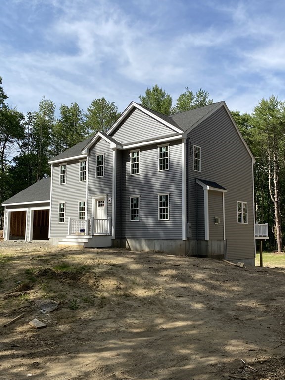 a front view of a house with a garage
