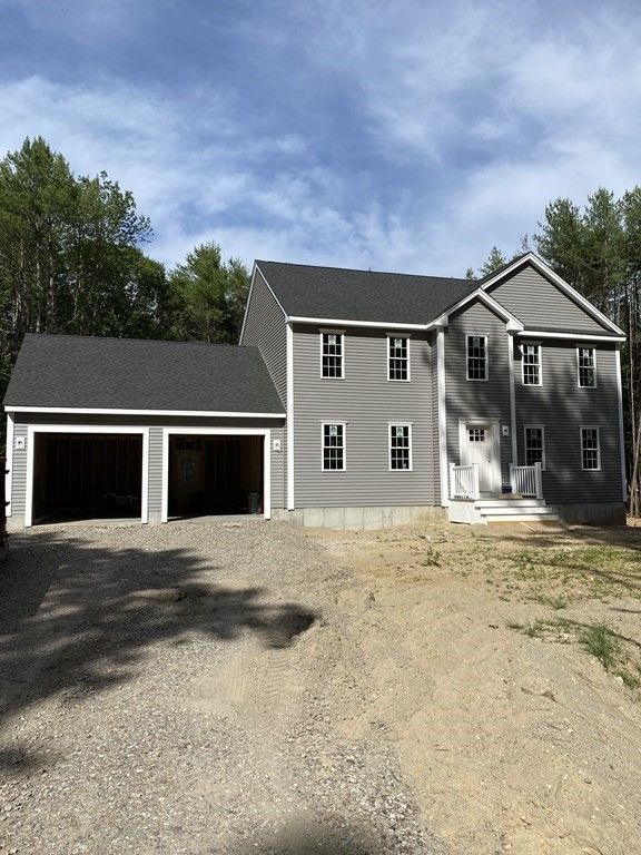 954 Walnut Plain Road Rochester, MA 02770 - Photo 2 of 8 front view of a house with a yard