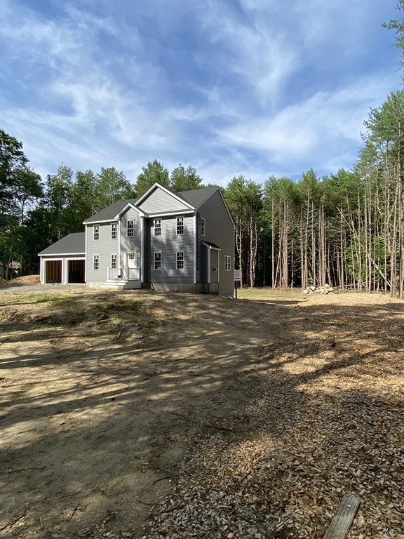 954 Walnut Plain Road Rochester, MA 02770 - Photo 3 of 8 a front view of a house with a yard