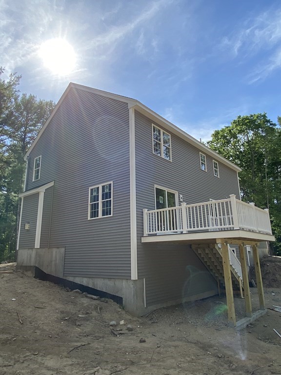 954 Walnut Plain Road Rochester, MA 02770 - Photo 4 of 8 a view of a house with a balcony