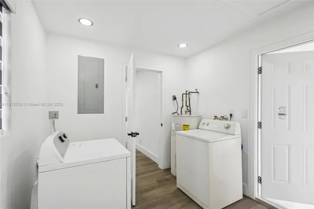 a view of bathroom with a washer and dryer