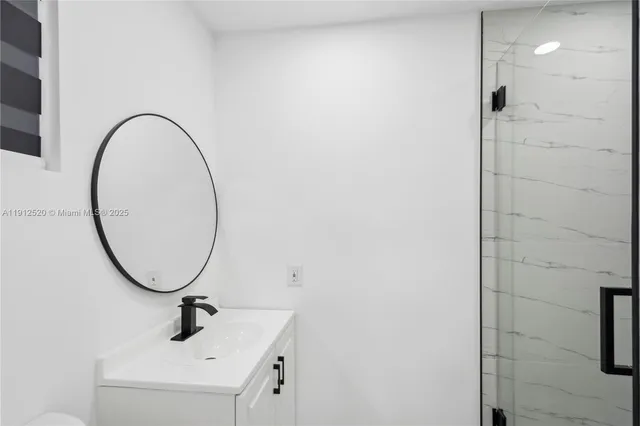 a bathroom with a sink and mirror