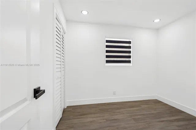 a view of a room with a wooden floor