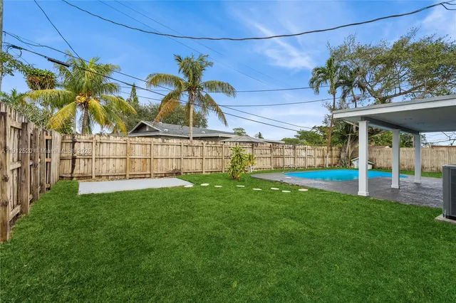 a view of a garden with a small cabin