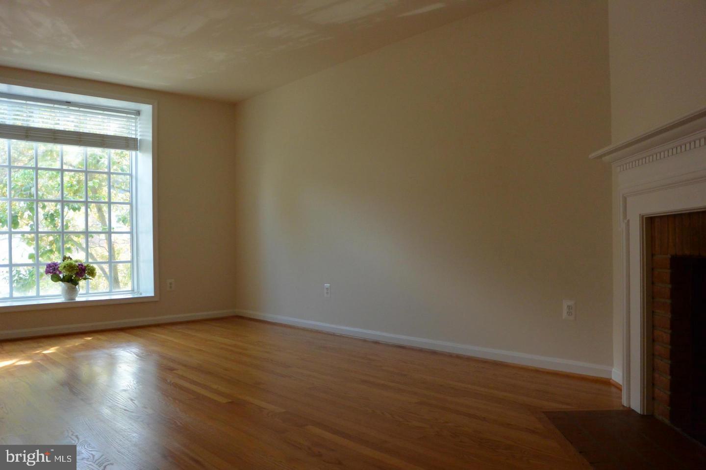 6750 Towne Lane Road McLean, VA 22101 - Photo 12 of 25 a view of an empty room with wooden floor and a window