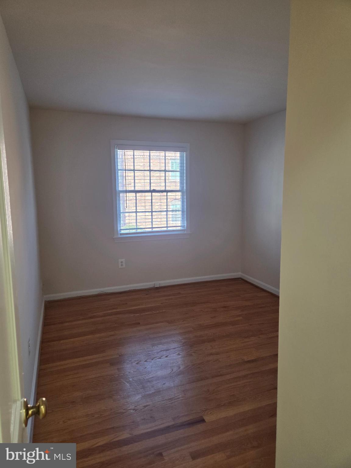 6750 Towne Lane Road McLean, VA 22101 - Photo 20 of 25 an empty room with wooden floor and windows