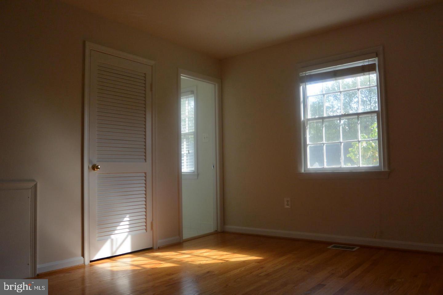 6750 Towne Lane Road McLean, VA 22101 - Photo 23 of 25 an empty room with wooden floor and windows