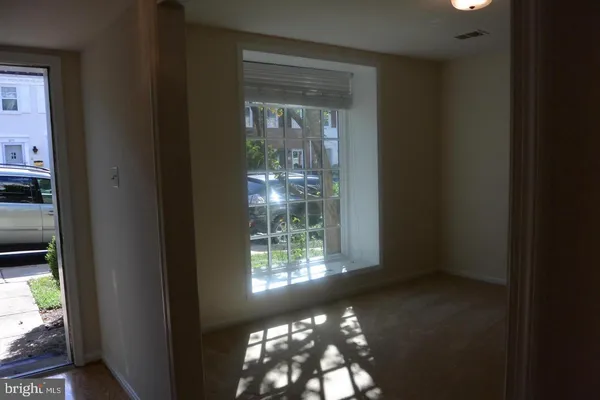 a view of a glass door and a window