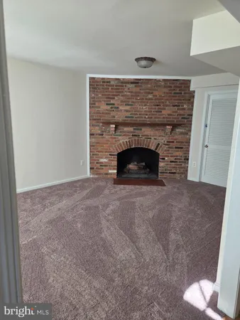 a living room with a fireplace