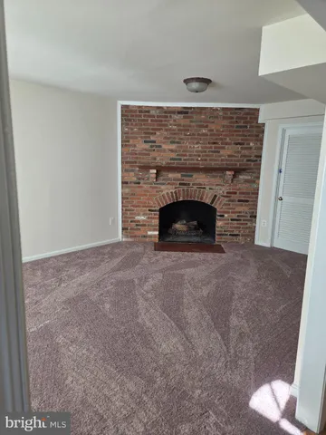 a living room with a fireplace