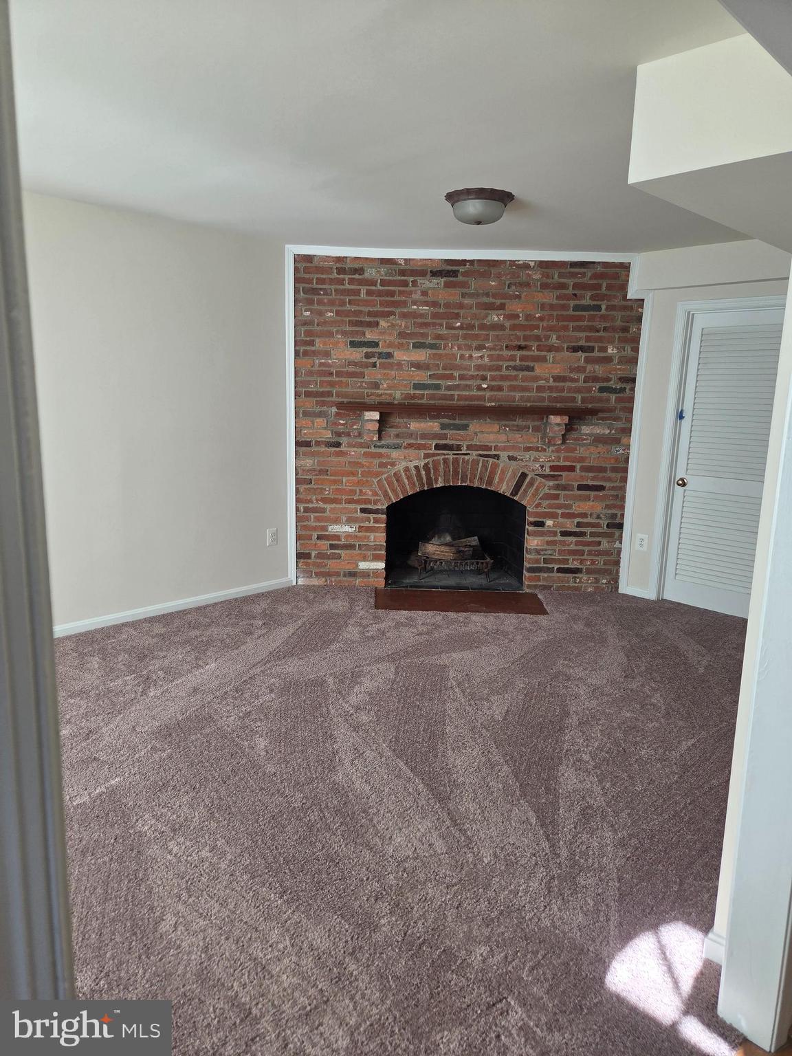 6750 Towne Lane Road McLean, VA 22101 - Photo 5 of 25 a living room with a fireplace